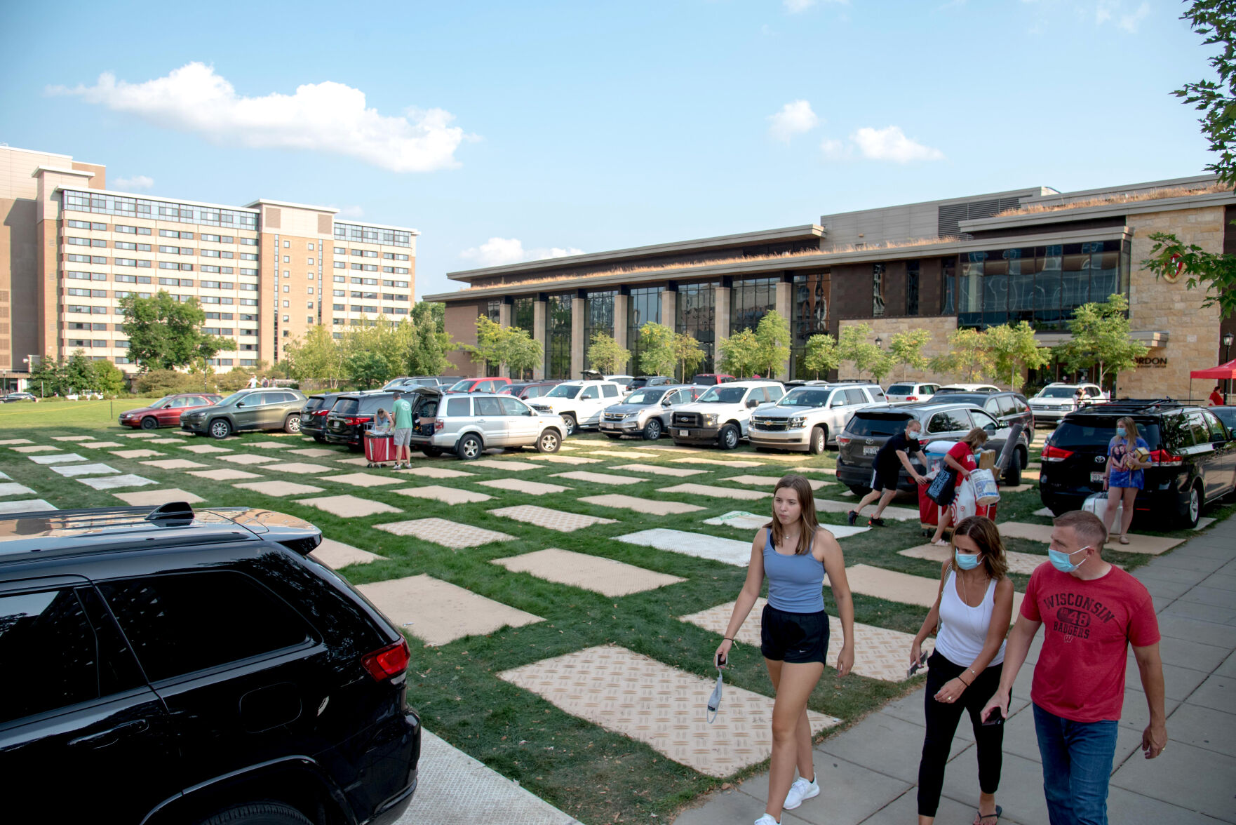 Families unpack their cars on the first day of freshman move-in to the residence halls at the University of Wisconsin-Madison